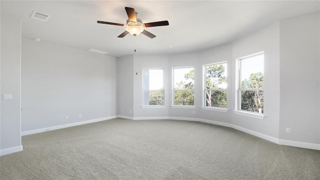 unfurnished room with carpet floors and ceiling fan