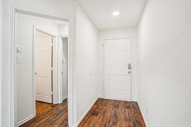 corridor featuring dark wood-type flooring