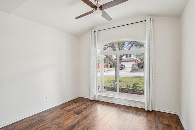 unfurnished room with ceiling fan, dark hardwood / wood-style floors, and vaulted ceiling