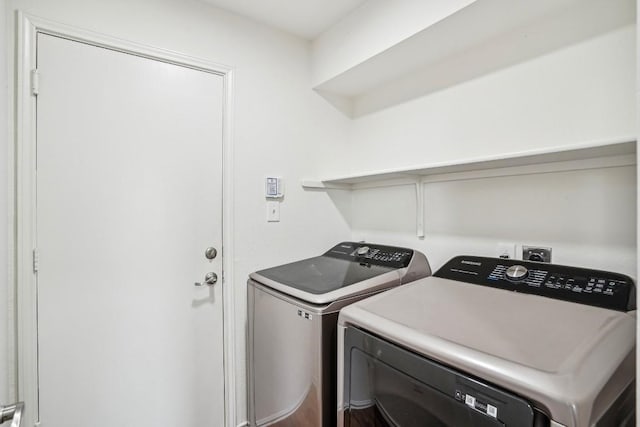 laundry room with washing machine and dryer