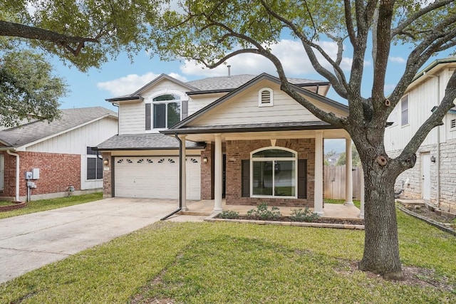 view of front of house featuring a garage and a front yard