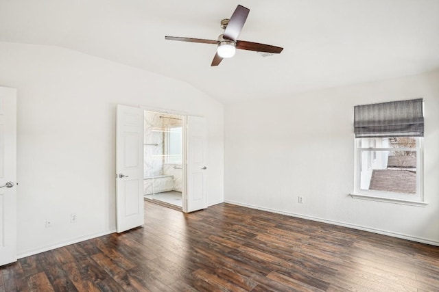 empty room featuring dark wood-type flooring, ceiling fan, and vaulted ceiling