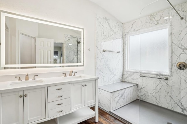 bathroom featuring vanity and a tile shower