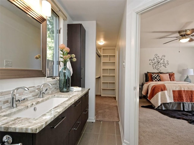 bathroom featuring ceiling fan, vanity, and tile patterned floors