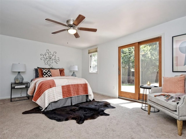 bedroom featuring light carpet, access to outside, and ceiling fan