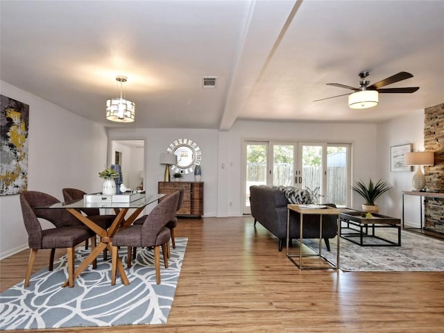 dining room featuring french doors, ceiling fan, and light hardwood / wood-style flooring