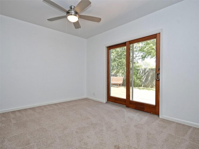 unfurnished room with ceiling fan and light colored carpet