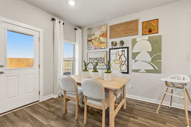 dining area with dark hardwood / wood-style floors