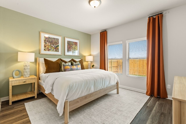 bedroom featuring dark hardwood / wood-style flooring