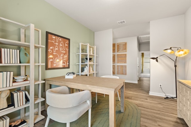 dining room featuring light hardwood / wood-style floors