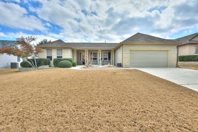 single story home featuring central AC, a garage, and a front yard