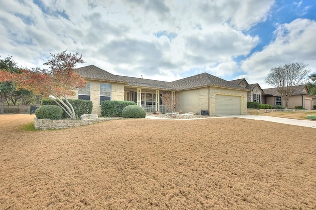 single story home featuring a garage and a front lawn