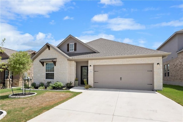 view of front of home with a garage and a front lawn