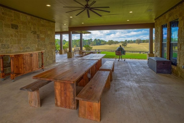 view of patio / terrace with a rural view and ceiling fan