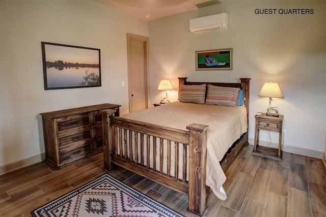 bedroom featuring a wall mounted air conditioner