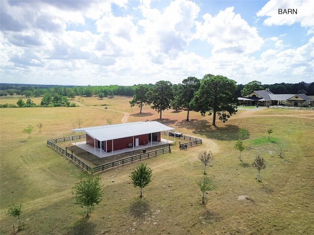 birds eye view of property with a rural view