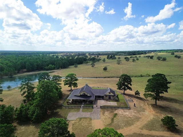 birds eye view of property featuring a rural view and a water view