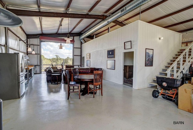 0000 Gotier Trace Rd, Smithville, TX 78957 - garage with freestanding refrigerator and wood walls