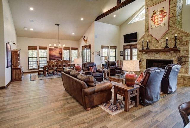0000 Gotier Trace Rd, Smithville, TX 78957 - living area with a chandelier, high vaulted ceiling, light wood finished floors, a fireplace, and beam ceiling
