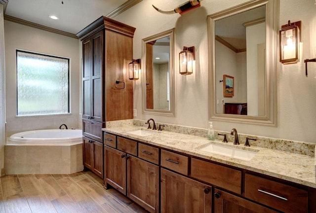 0000 Gotier Trace Rd, Smithville, TX 78957 - full bath with crown molding, a bath, double vanity, and wood finished floors