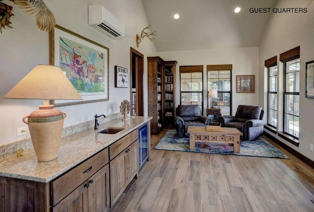 0000 Gotier Trace Rd, Smithville, TX 78957 - office featuring beverage cooler, a wall mounted air conditioner, a sink, light wood-style floors, and recessed lighting