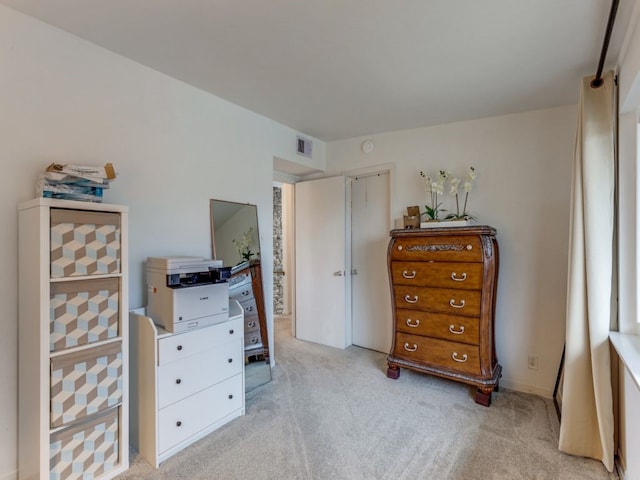 bedroom with light colored carpet