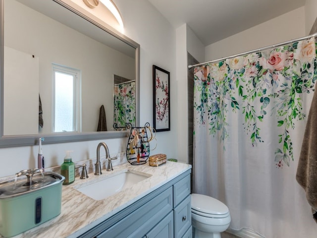 bathroom with vanity, a shower with curtain, and toilet