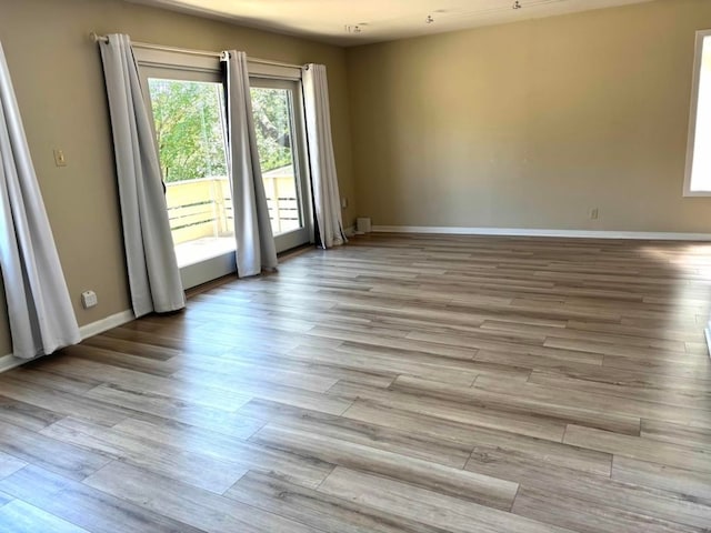 2102 W 11th St Unit A, Austin, TX 78703 - unfurnished room with light wood-type flooring and baseboards