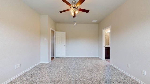 carpeted spare room featuring ceiling fan