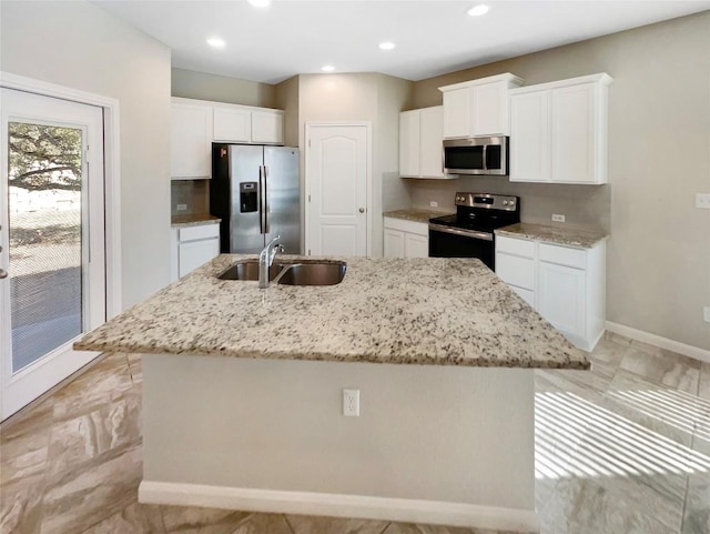 116 San View Dr, Georgetown, TX 78628 - kitchen featuring stainless steel appliances, a kitchen island with sink, white cabinetry, and recessed lighting