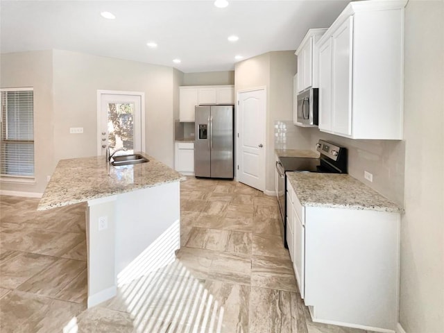 116 San View Dr, Georgetown, TX 78628 - kitchen featuring stainless steel appliances, a center island with sink, white cabinetry, recessed lighting, and light stone counters