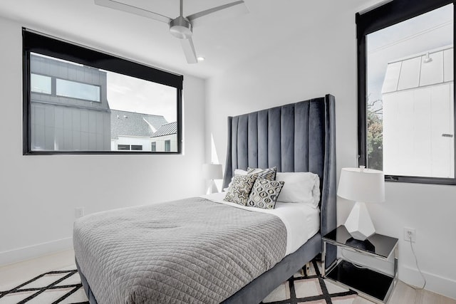 bedroom featuring a ceiling fan and baseboards