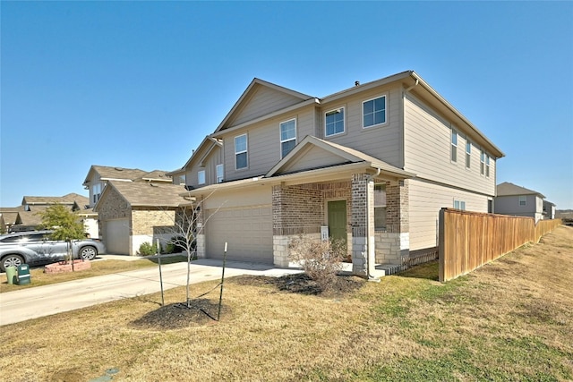 view of front of home featuring a garage and a front lawn