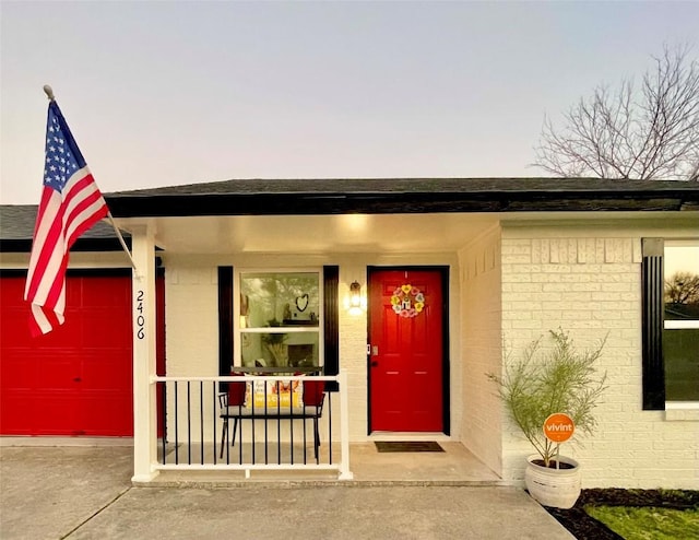 exterior entry at dusk with a garage