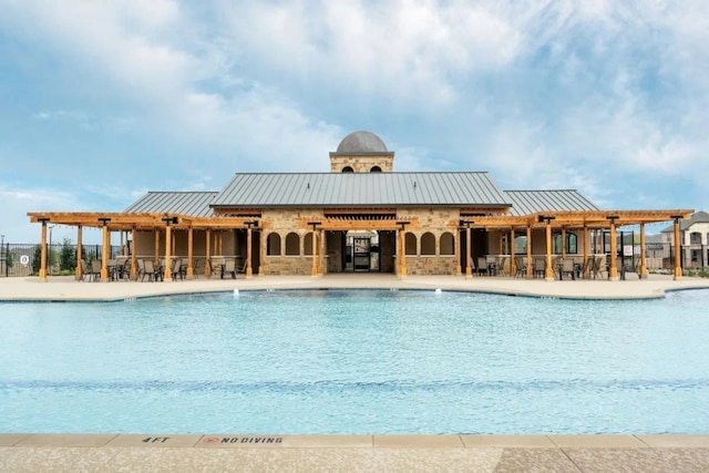 view of swimming pool featuring a patio area