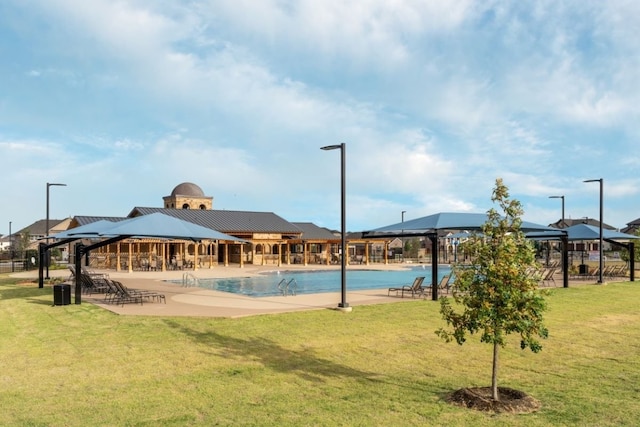 view of swimming pool featuring a gazebo and a lawn