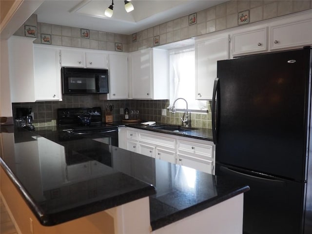 kitchen featuring sink, black appliances, kitchen peninsula, and white cabinets