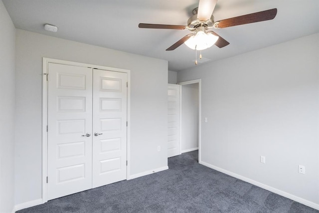 unfurnished bedroom featuring a closet, ceiling fan, and dark colored carpet