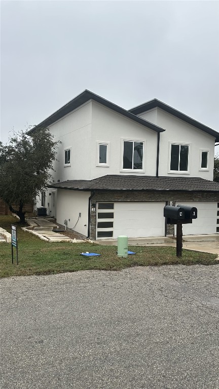 view of property exterior with an attached garage and stucco siding