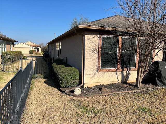 view of property exterior featuring a yard