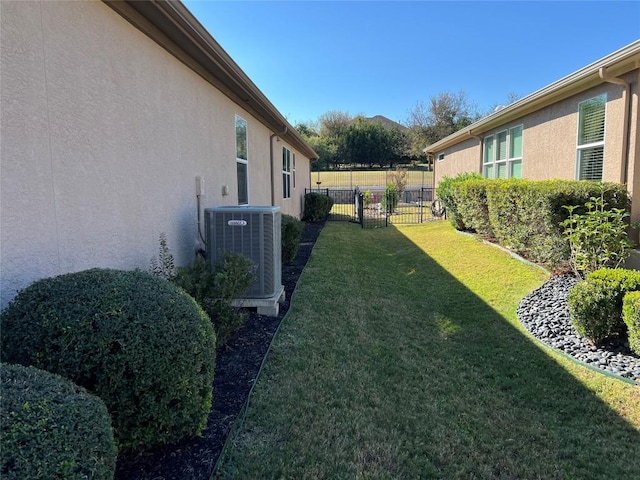 view of yard with central AC