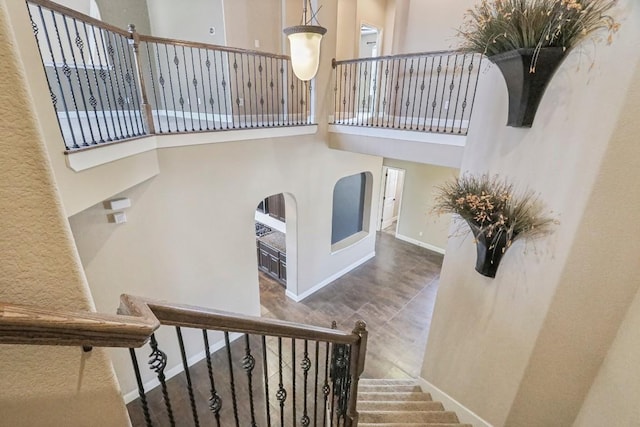 stairway with a towering ceiling