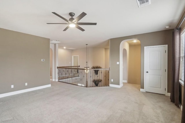 carpeted empty room with ceiling fan