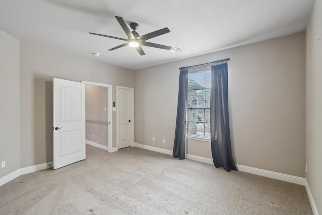 unfurnished bedroom with light carpet and ceiling fan