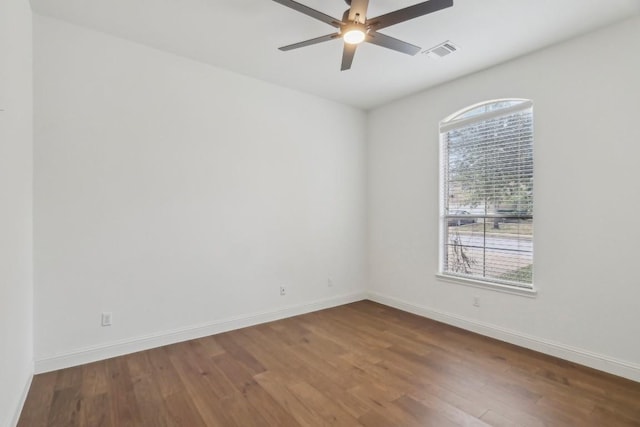 empty room with wood-type flooring and ceiling fan