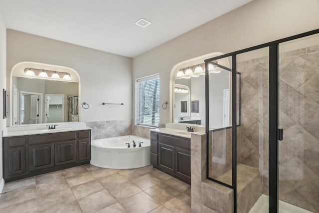 bathroom with vanity, separate shower and tub, and tile patterned flooring