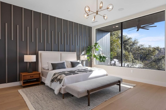 4502 Hyridge Dr, Austin, TX 78759 - bedroom featuring a chandelier and wood finished floors