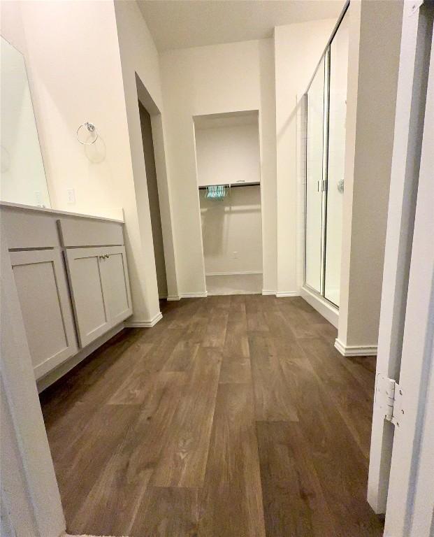 hall with dark hardwood / wood-style flooring