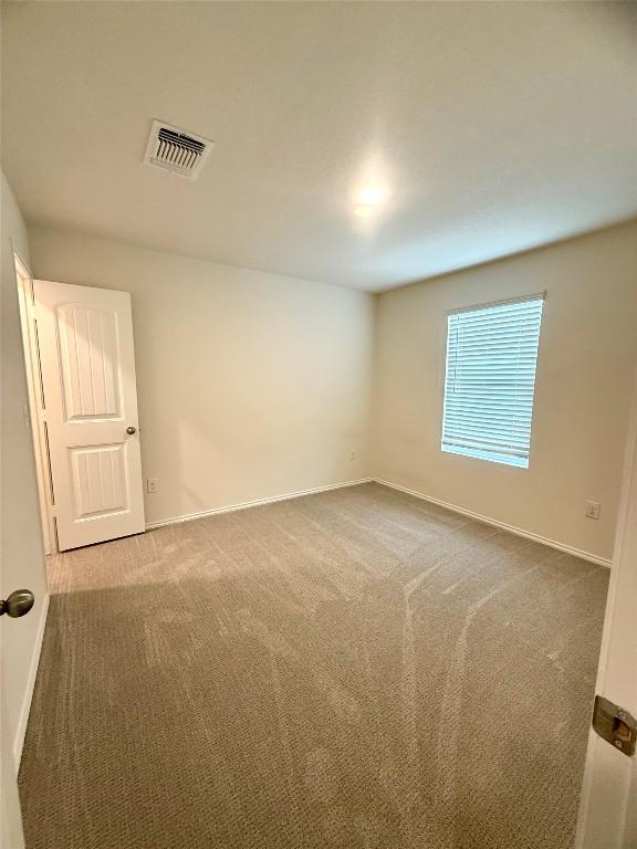 unfurnished room with carpet flooring