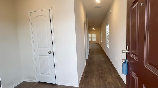 corridor featuring dark hardwood / wood-style floors